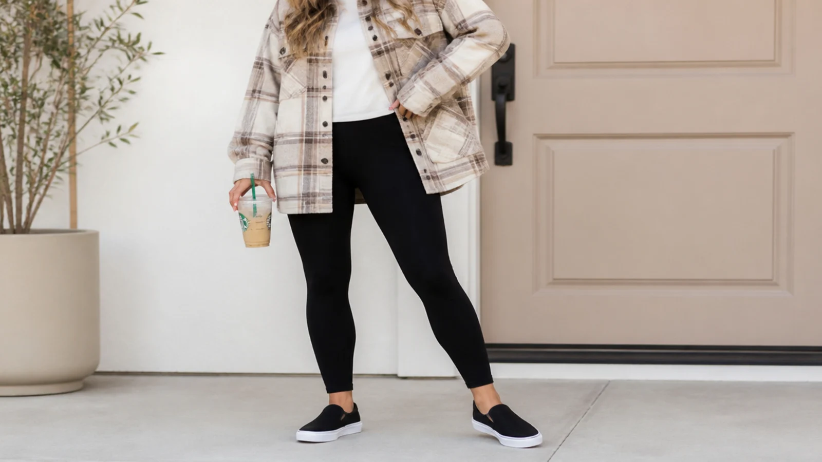 Faceless errand outfit with an oversized plaid flannel shirt, black leggings and slip-on sneakers