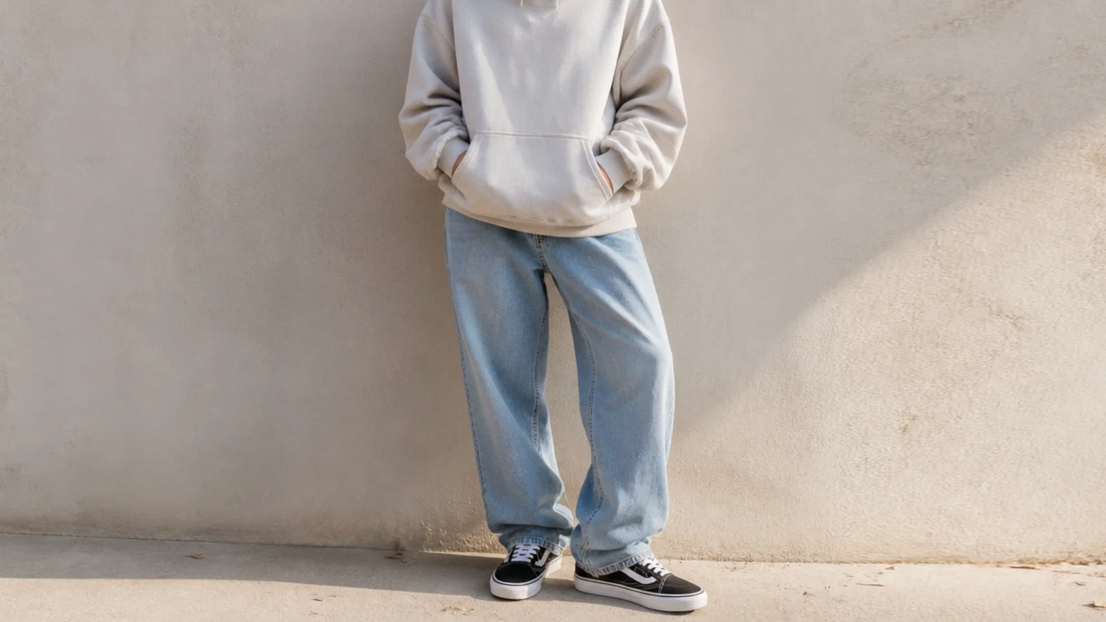 Faceless outfit with black Vans Old Skool skate sneakers with a white side stripe, baggy jeans and a hoodie