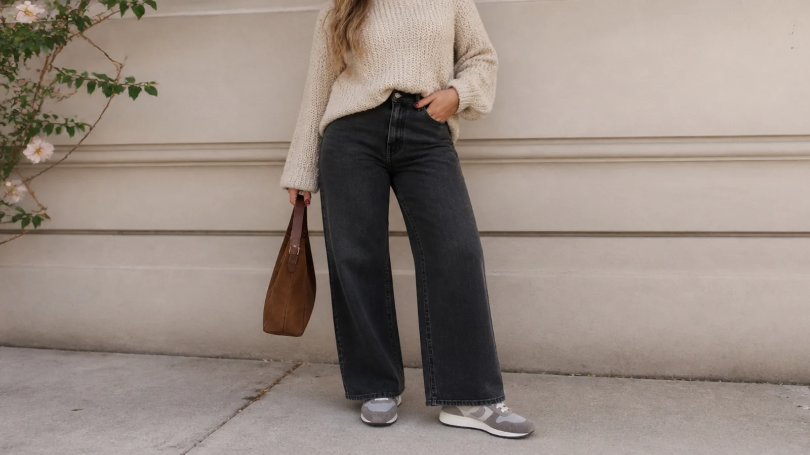 Faceless fall outfit with a gray suede retro runner, wide-leg dark jeans and a chunky oatmeal knit