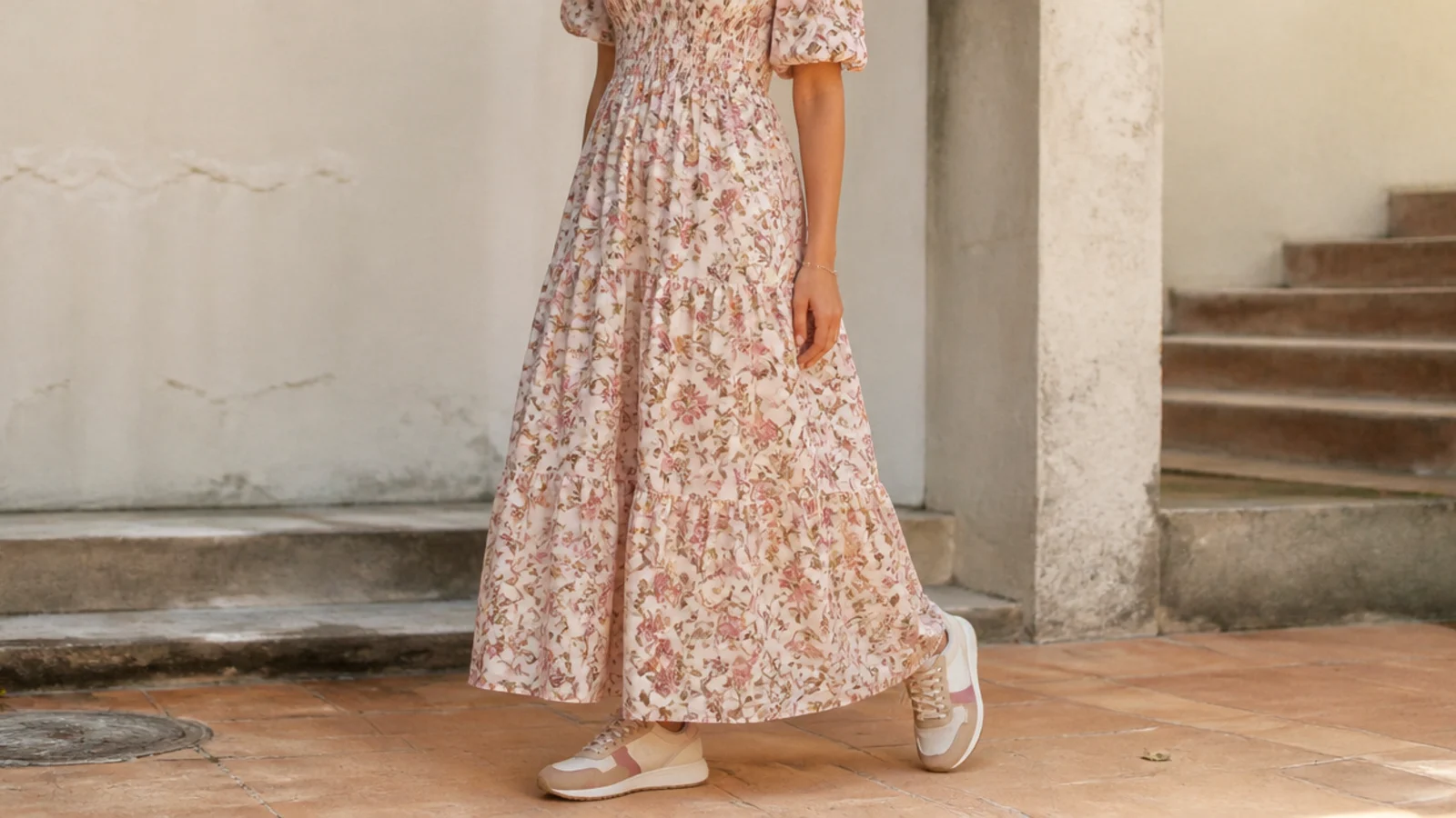 Faceless full-length shot of a floral maxi dress with retro suede and mesh running sneakers