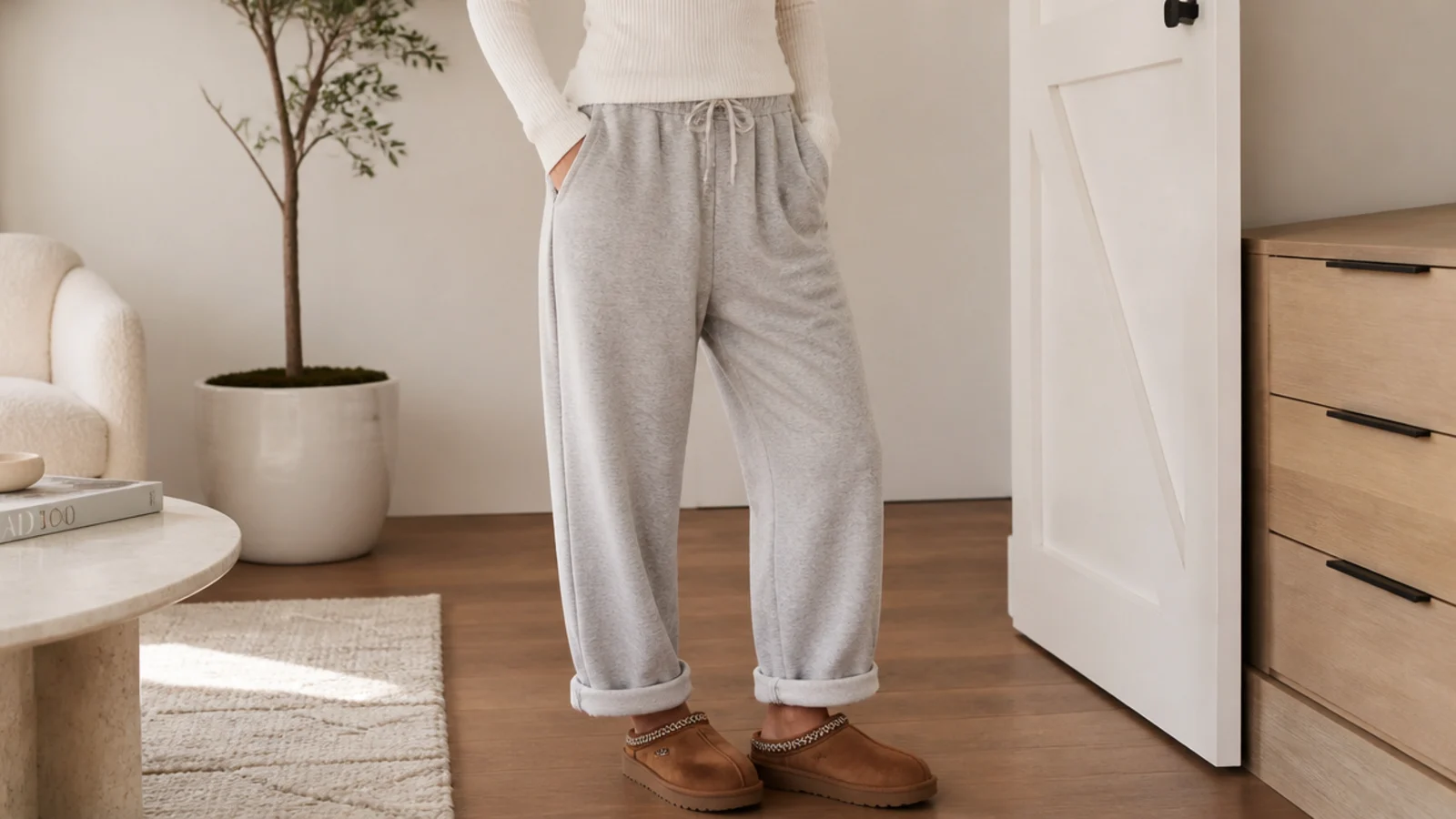 Faceless outfit with gray oversized sweatpants cuffed above chestnut UGG Tasman slippers