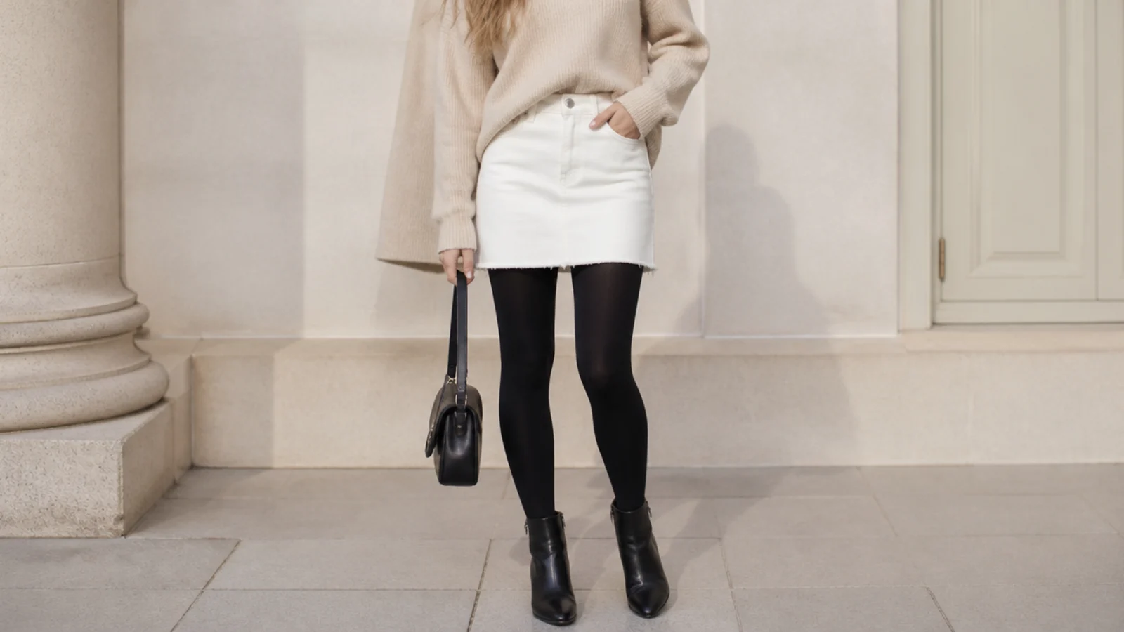 Faceless winter outfit with a white denim mini skirt, black opaque tights and ankle boots