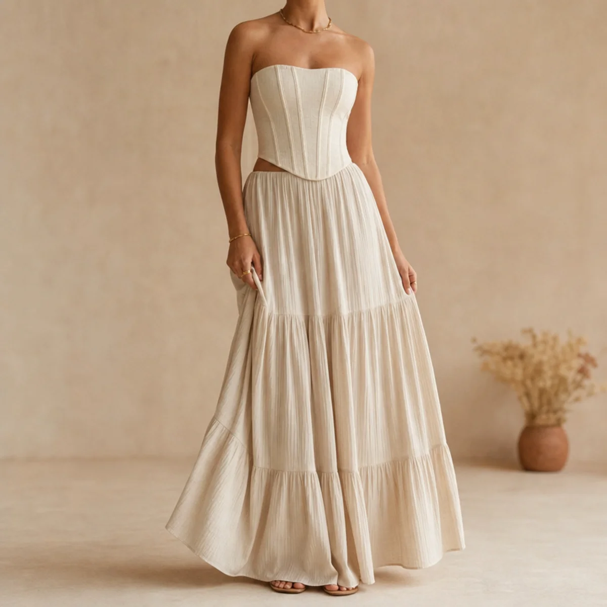 Faceless full-length shot of a corset top with a flowing summer maxi skirt