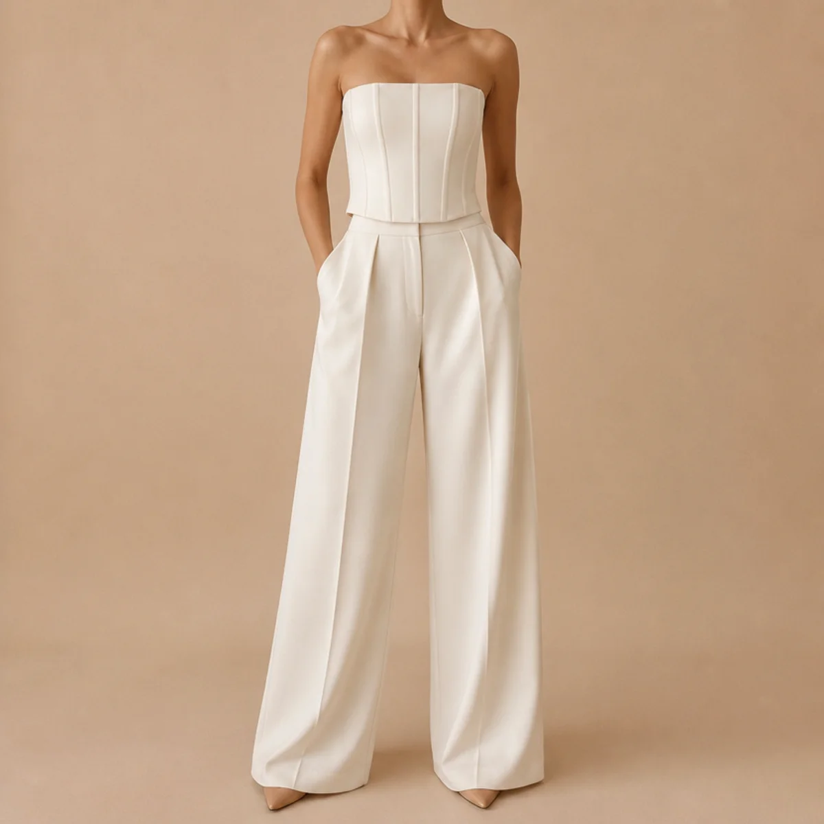 Faceless full-length shot of a white corset top with high-waisted wide-leg trousers