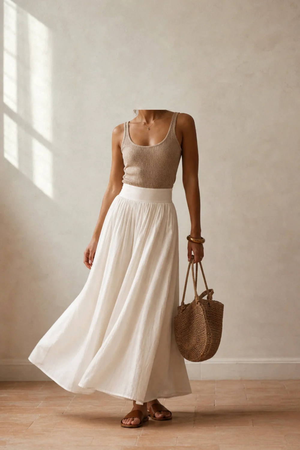 Faceless white maxi skirt outfit with a fitted tank and sandals