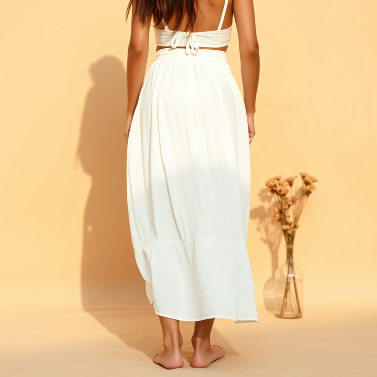 Faceless full-length shot of a white skirt over a bikini top for the beach